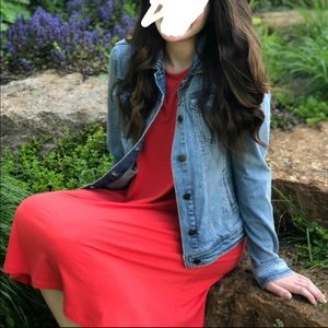 Coral colored dress.